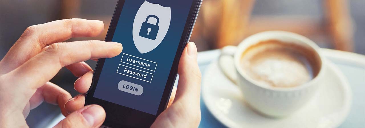 Fingers adding username and password to phone
