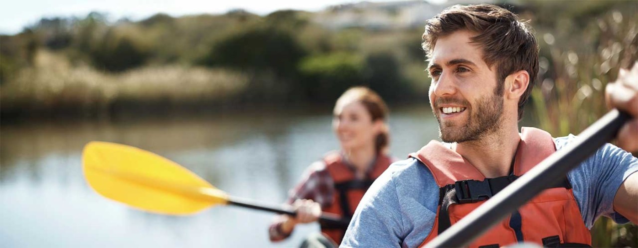 Young people in a kayak.