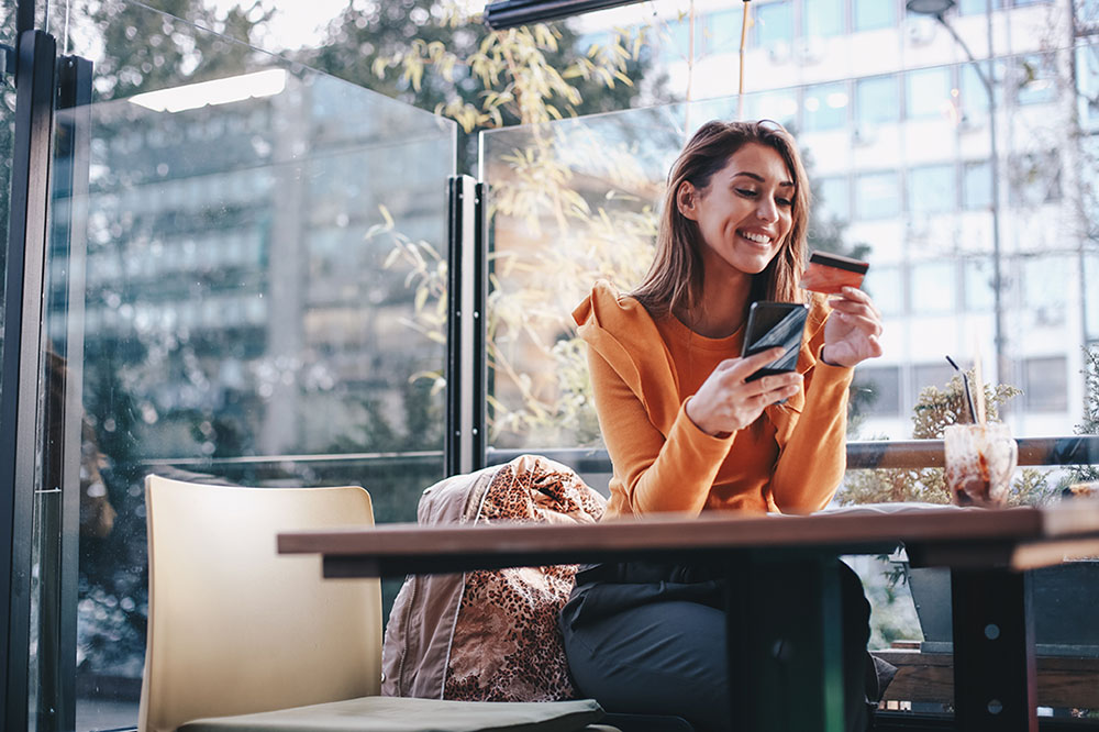 Woman reading her credit card.