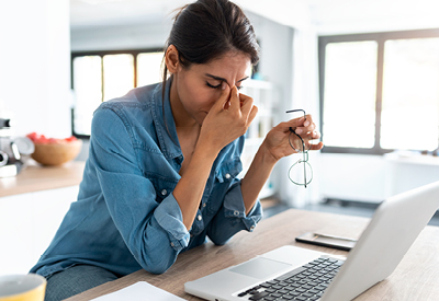 Woman stressed out at her laptop