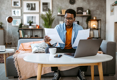 African-American man working on his laptop