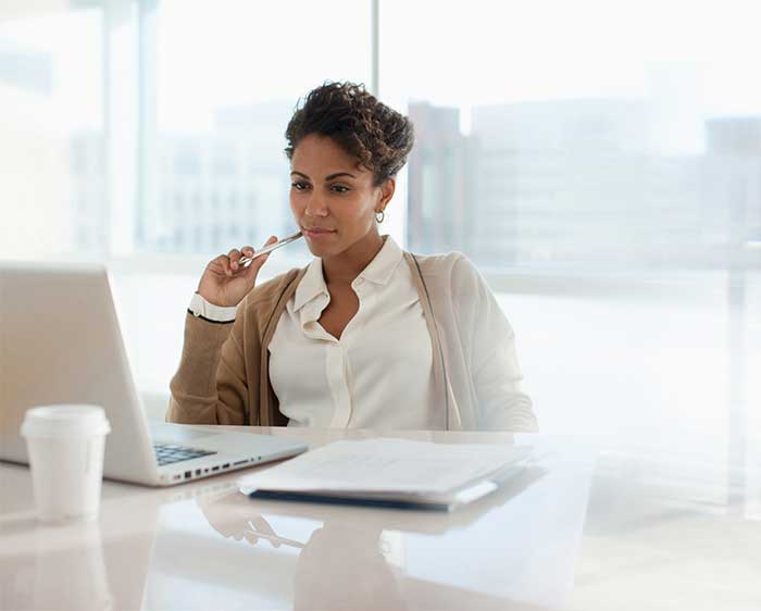 Woman looking at her laptop