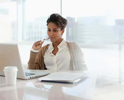 Woman looking at her laptop