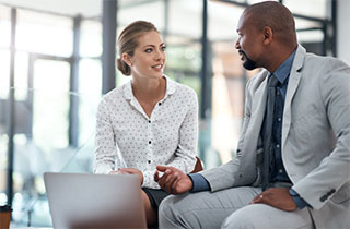 Male and female business people talking.