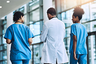 Doctor and nurses walking.