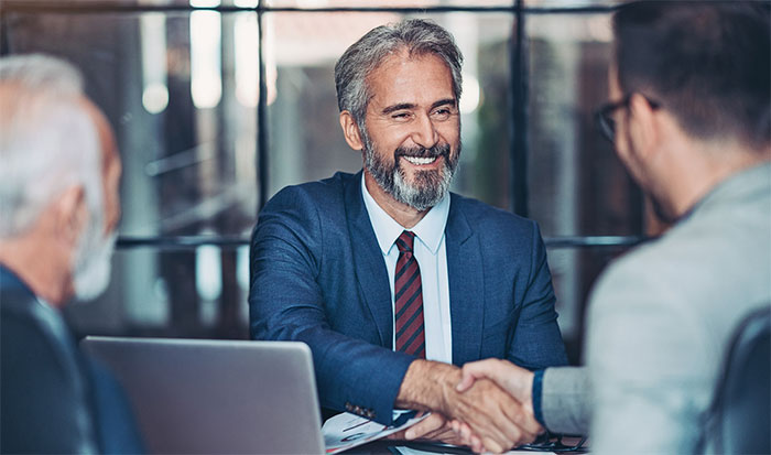 Banker shaking hands with a client