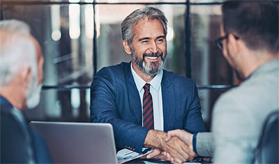 Banker shaking hands with a client
