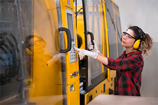 Woman operating heavy machinery.