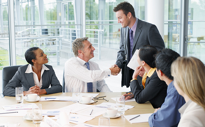 handshake during a business meeting