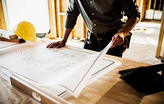 Architect looking at architectural drawings