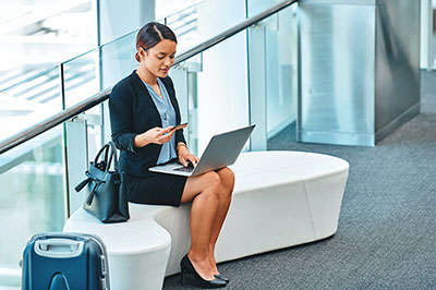 woman entering her card number on her laptop