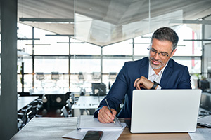 man working in his notebook