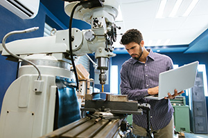 man working with a robot