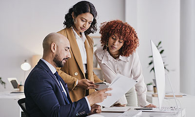 man sharing his notes with colleagues