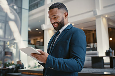 man working on his tablet