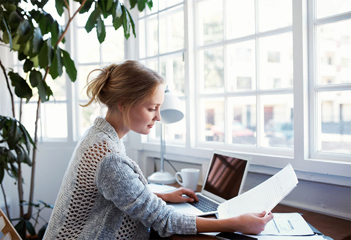Woman looking over her finances