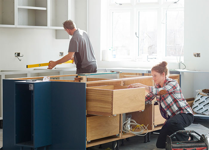 Couple renovating a kitchen