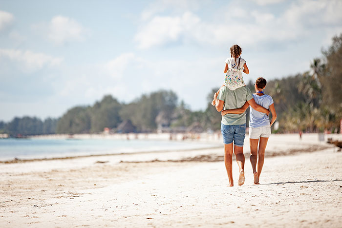 Family walking on the beach