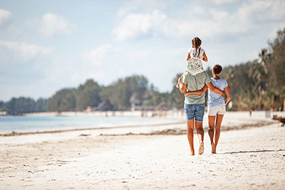 Family walking on the beach
