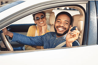 Driving away with a new car.