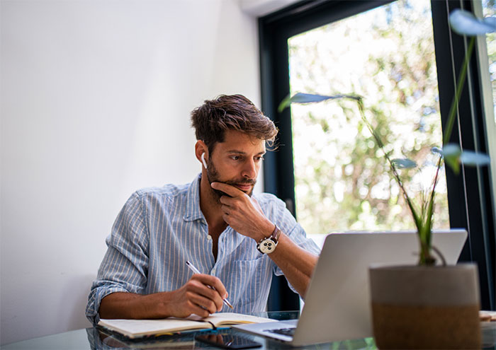 Man listening to music while working.