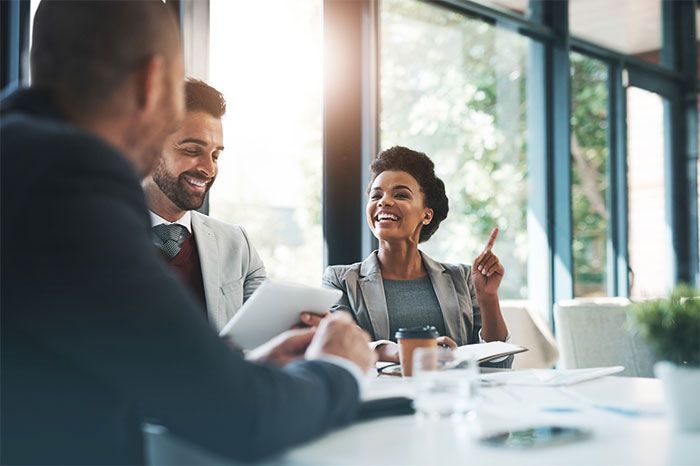 group of three people in a meeting