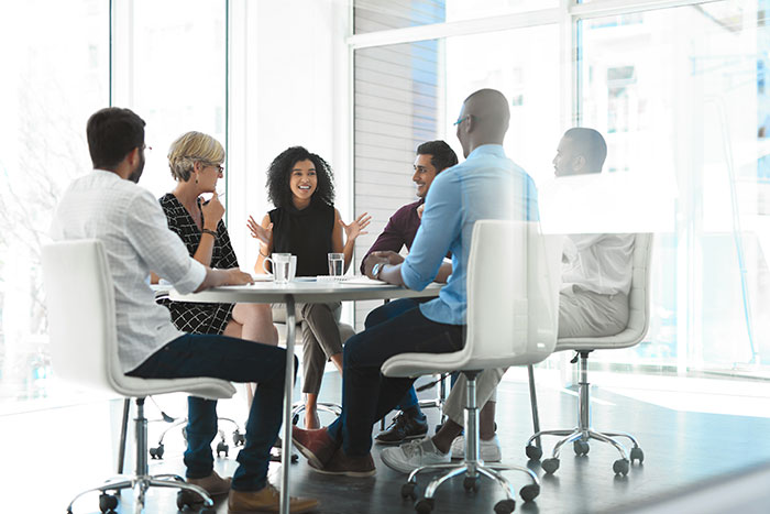 People chatting in business room.