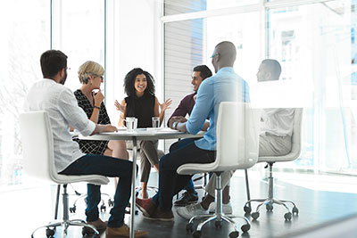 People chatting in business room.