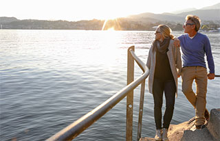 Retired couple looking at lake
