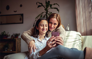 Mother and daughter taking selfie